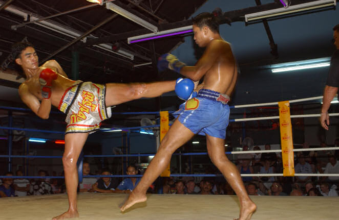 Two Thai kick boxers going at it.