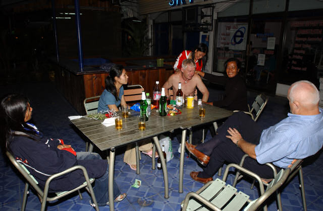 Thai women providing TLC on an intoxicated  Barry