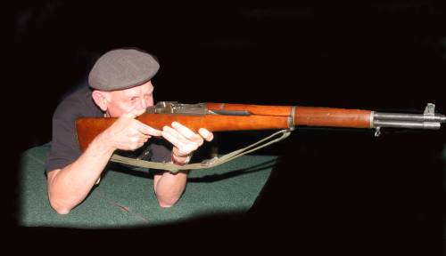 Jack Corbett firing M-1 rifle