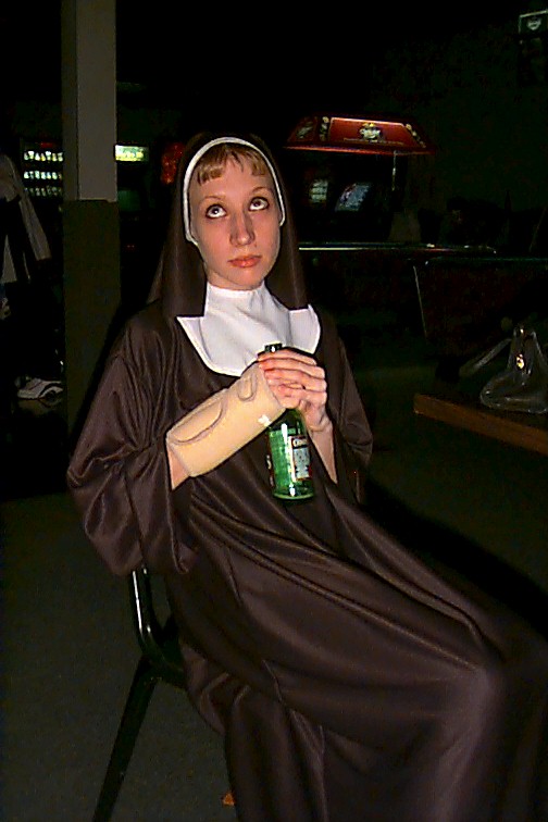 Alabama, stripper nun wearing habit while drinking a beer