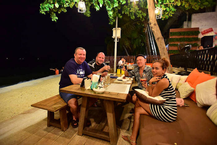 picture:  My Thai girlfriend and I at Surf and Turf Restaurant with two Russian friends