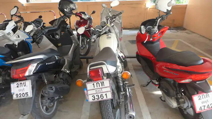 picture:  Jack's Yamaha SR400, his Nmax 155 and his girlfriend's Honda PCX 150