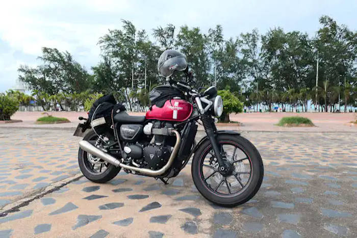 picture:  My Triumph Street twin on the beach near Rayong Thailand