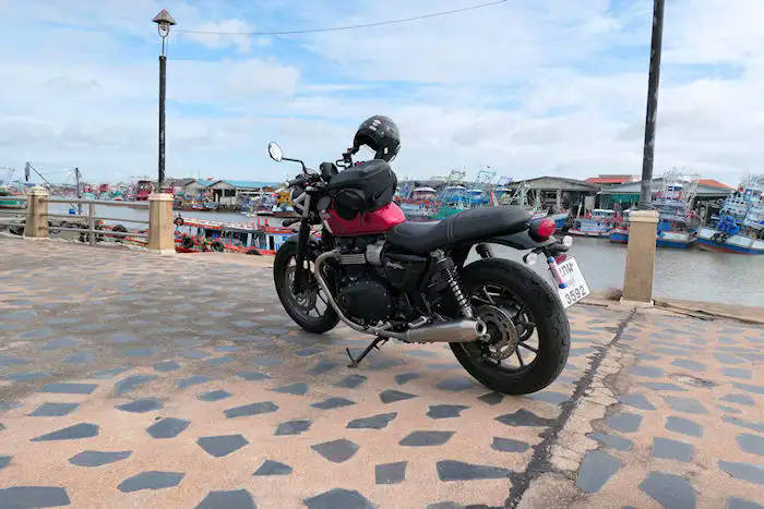 picture:  Of Triumph 900 Street Twin in secluded beach area near Rayong, Thailad
