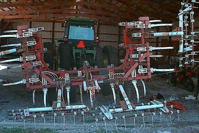 4650 John Deere tractor with a field cultivator