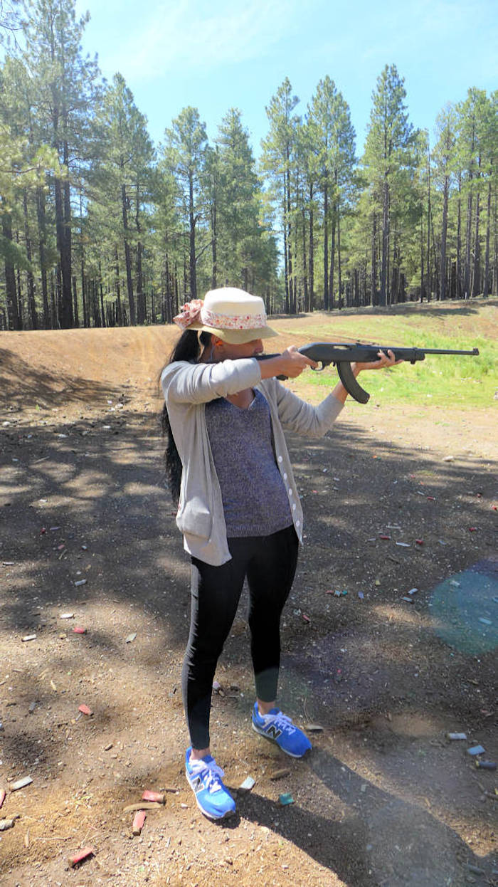 picture:  my Thai girlfriend shooting 22 semi automatic rifle near the Grand Canyon