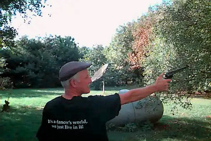 picture: author Jack Corbett shooting his Colt 45 at his idyllic farmstead