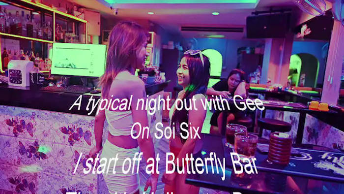 picture of Gee convincing one of the bargirls to do a few Buttefly Bar Videos