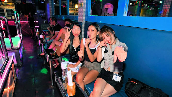 MJ Kittybar girls posing for Jack Corbett's Nikon camera
