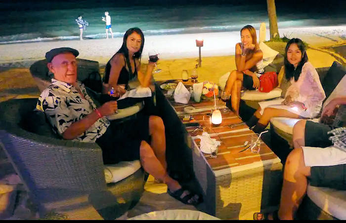 picture:  May May, Kwan and Phone on the Pullman Resort Beach